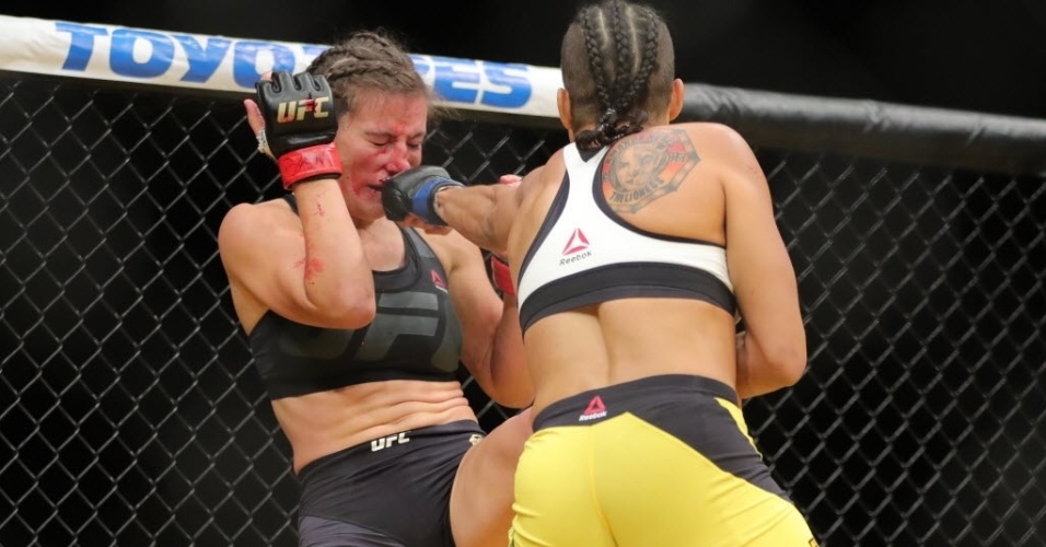 brasileira-amanda-nunes-acerta-soco-na-cara-de-miesha-tate-na-disputa-de-cinturao-do-peso-galo-no-ufc-200-1468129543383_956x500